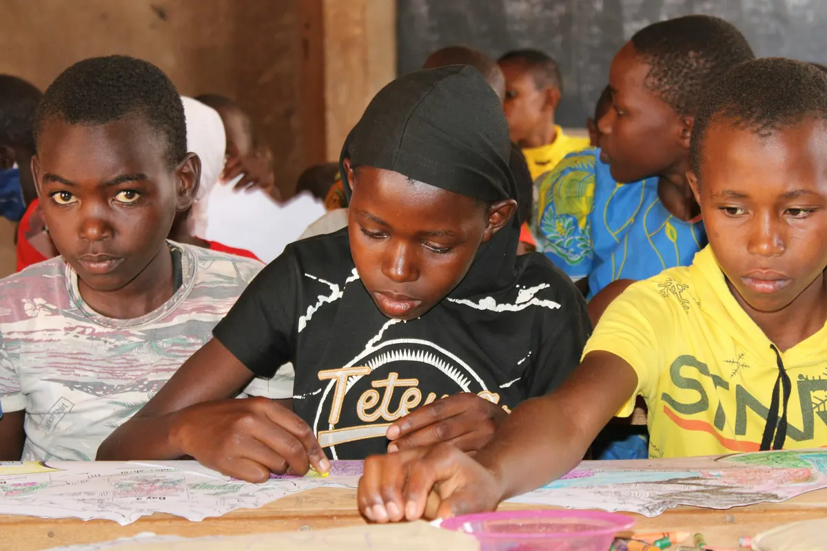 Children drawing together at a table