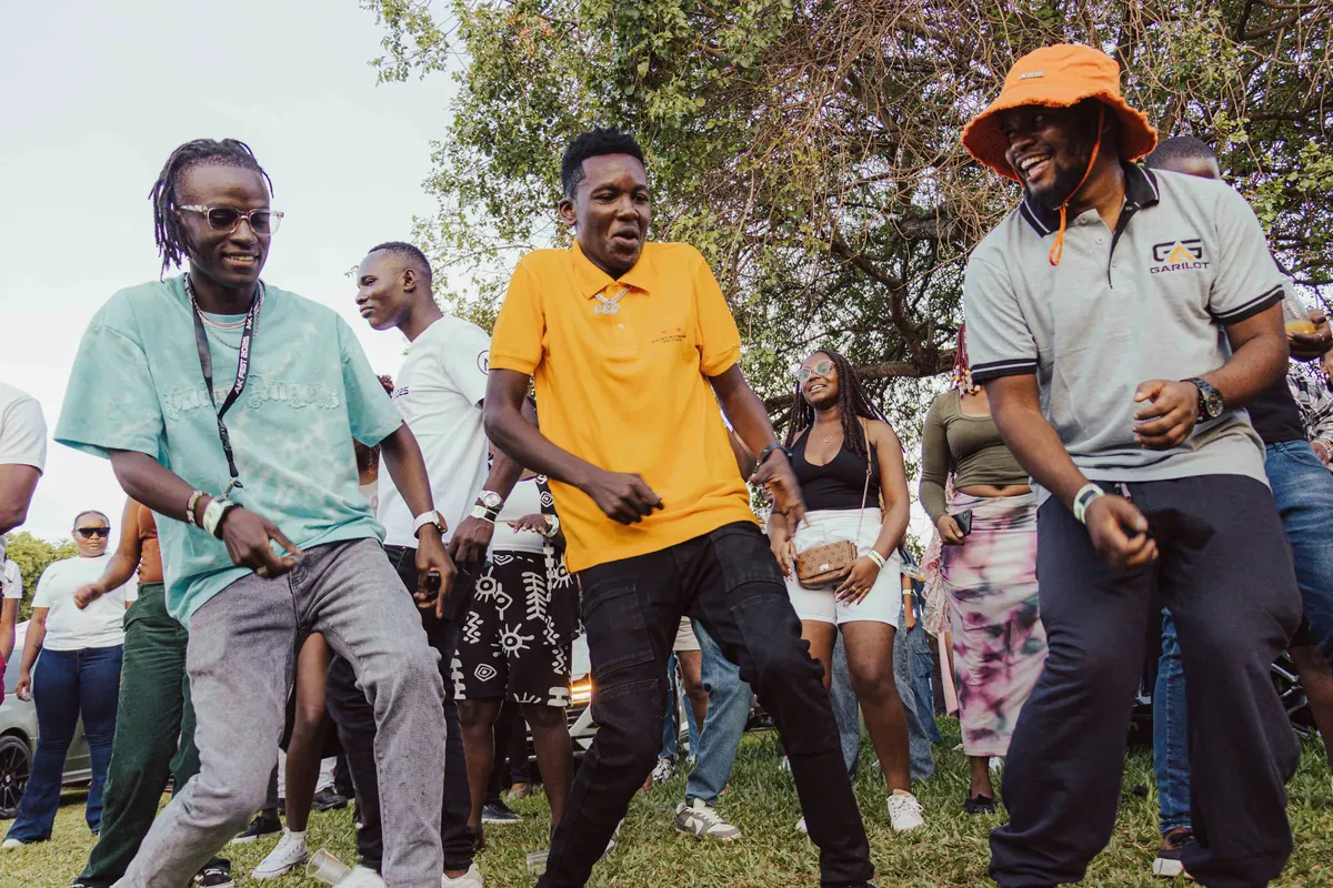People dancing together at an outdoor community event